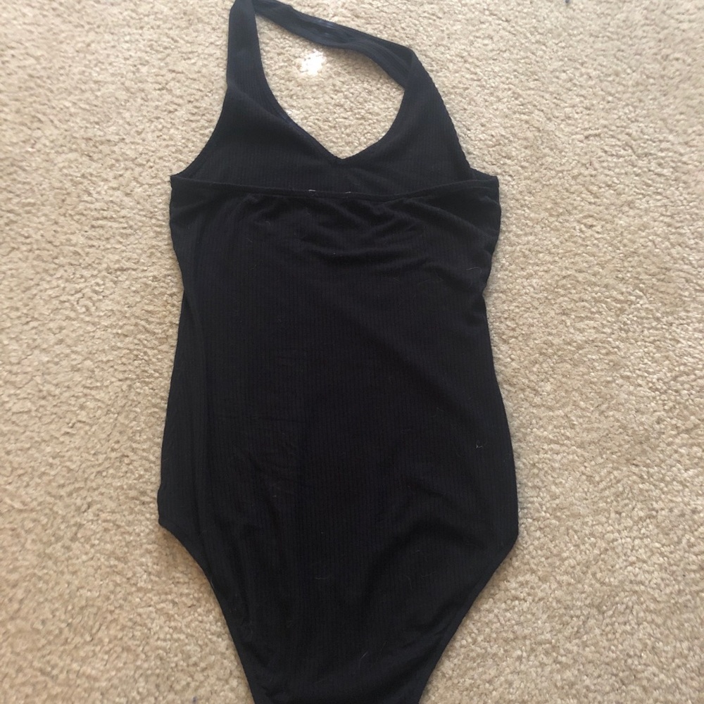 Black v dip neckline body suit.